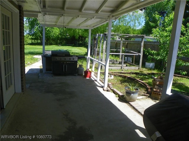 view of patio / terrace with a fenced backyard and a grill