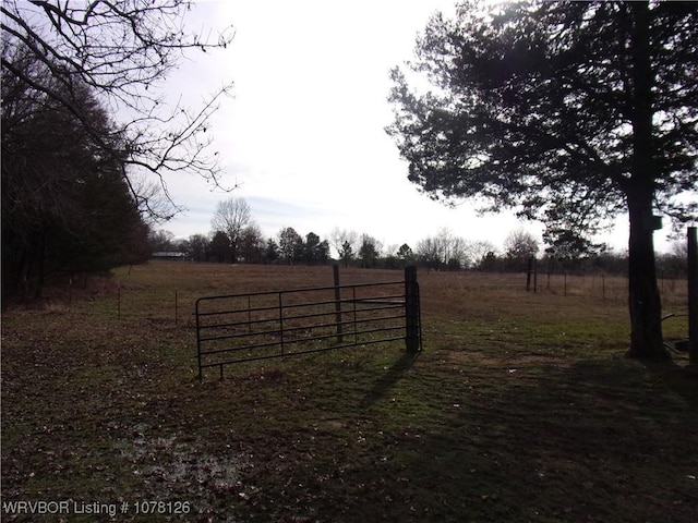 view of gate featuring a rural view