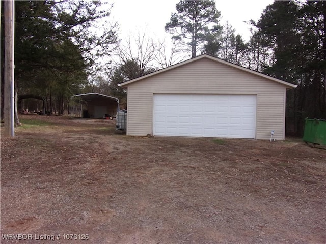 garage featuring a carport