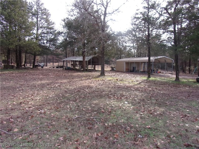 view of yard with a carport