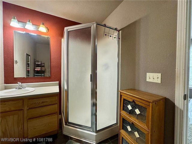 11739 282nd Hwy, Mountainburg, AR 72946 - bathroom with a textured wall, vanity, a stall shower, and a textured ceiling