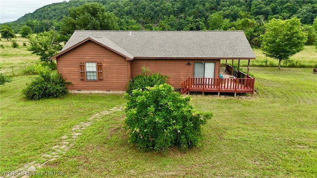 11739 282nd Hwy, Mountainburg, AR 72946 - view of front of home featuring a wooden deck, a front yard, roof with shingles, a forest view, and crawl space