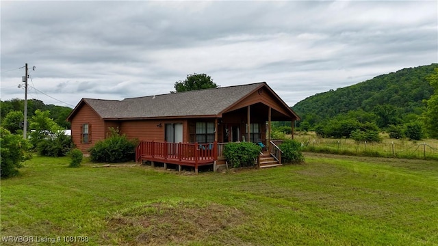 11739 282nd Hwy, Mountainburg, AR 72946 - view of front of property featuring a front yard, a wooden deck, and roof with shingles