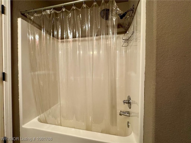 11739 282nd Hwy, Mountainburg, AR 72946 - bathroom with a textured wall and shower / bath combo