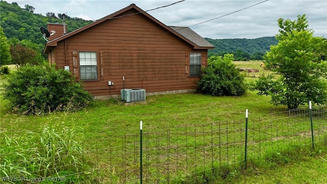 11739 282nd Hwy, Mountainburg, AR 72946 - view of side of property featuring a central air condition unit and a chimney