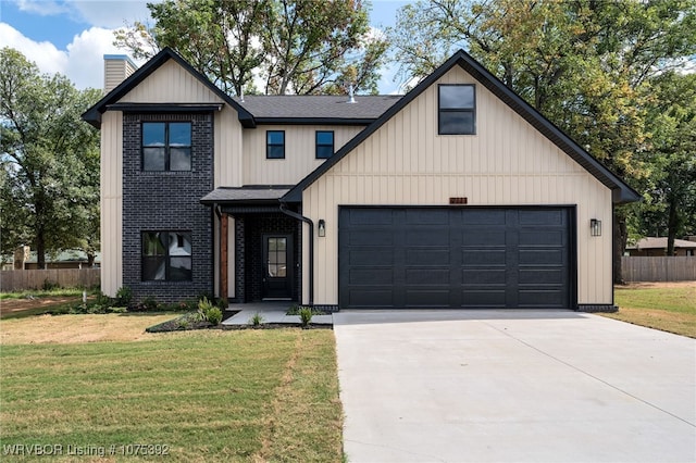 modern inspired farmhouse with a garage and a front yard