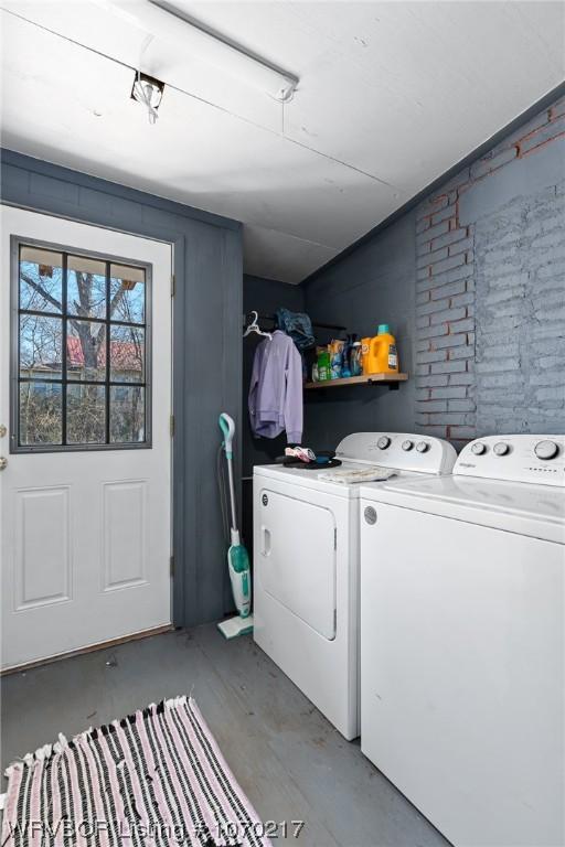 washroom featuring washer and clothes dryer