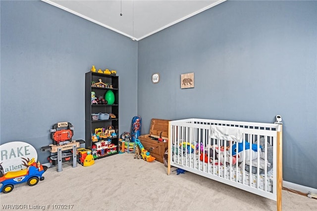 carpeted bedroom with a nursery area