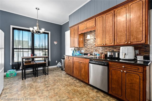 kitchen with stainless steel dishwasher, a chandelier, dark countertops, backsplash, and ornamental molding