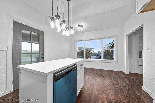 kitchen with white cabinets, dark wood-style floors, dishwashing machine, pendant lighting, and light countertops