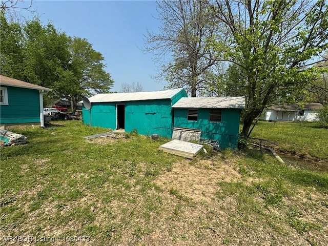 739 Pine St, Waldron, AR 72958 - exterior space with an outdoor structure and a lawn