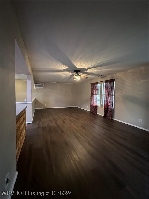 interior space featuring ceiling fan and dark wood-type flooring