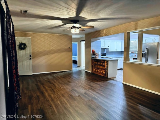 kitchen with dark wood-type flooring, white cabinets, stainless steel refrigerator with ice dispenser, ceiling fan, and range