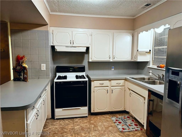 kitchen featuring white range oven, tasteful backsplash, white cabinetry, and sink