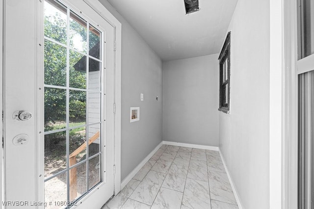 entryway with light marble finish flooring and baseboards