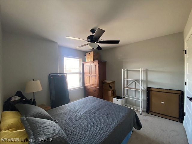 bedroom with light carpet and ceiling fan