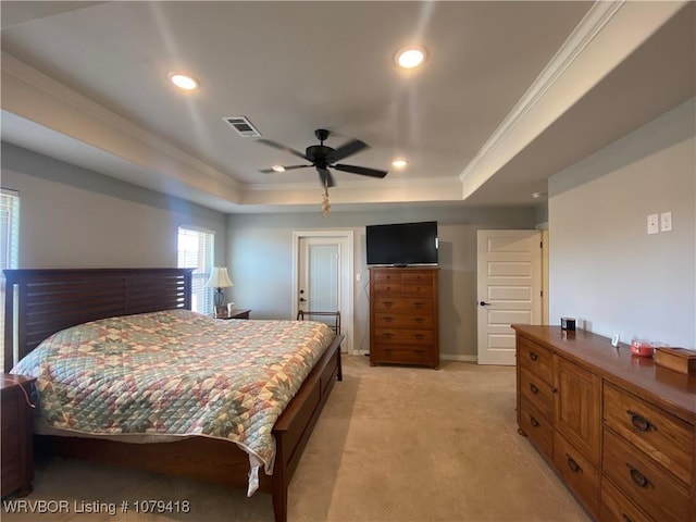 bedroom featuring recessed lighting, light colored carpet, visible vents, ornamental molding, and a raised ceiling