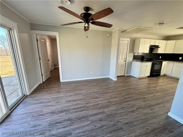 kitchen with dark wood-style floors, white cabinets, and black electric range oven