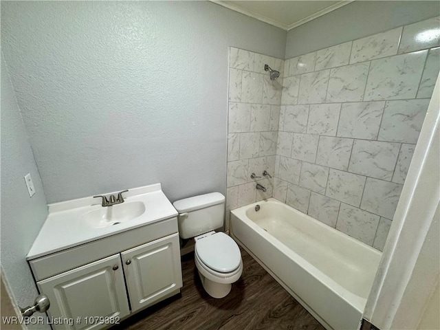 full bathroom with toilet, shower / bath combination, wood finished floors, vanity, and crown molding