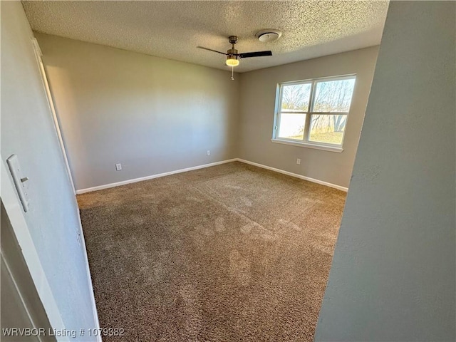 unfurnished room with carpet, ceiling fan, a textured ceiling, and baseboards