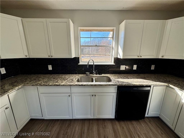 kitchen featuring dark wood-style floors, black dishwasher, white cabinets, and a sink