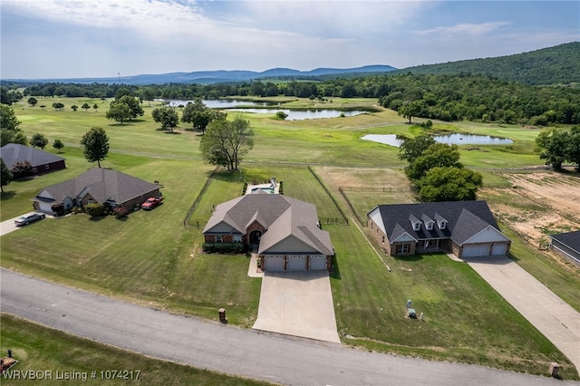 drone / aerial view with a rural view and a water and mountain view