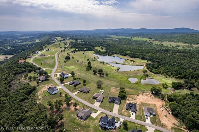 aerial view featuring a water and mountain view