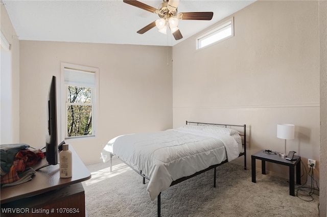 bedroom featuring ceiling fan and vaulted ceiling