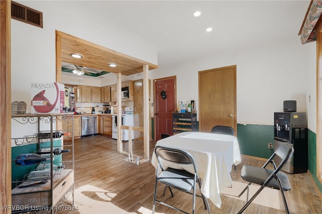 dining area featuring ceiling fan and light hardwood / wood-style flooring