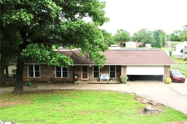 8436 Sebastian Lake Dr, Hackett, AR 72937 - ranch-style home featuring a garage, driveway, a front lawn, and brick siding