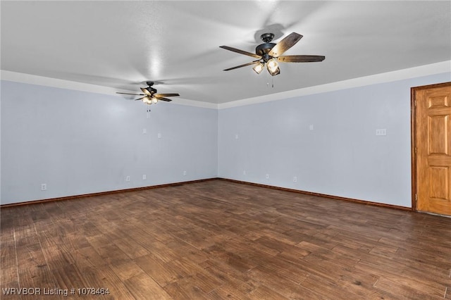 unfurnished room with ceiling fan and dark hardwood / wood-style floors