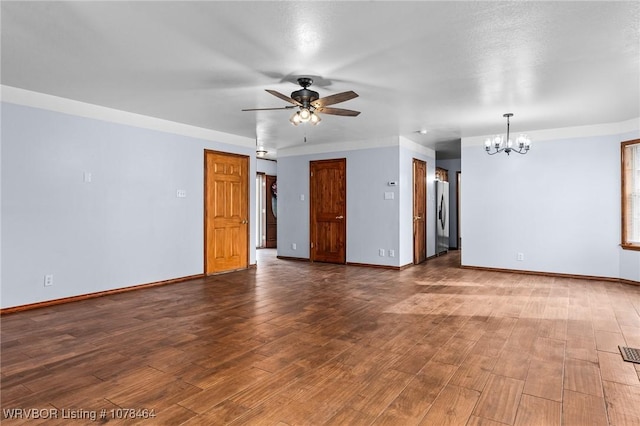 spare room with ceiling fan with notable chandelier and hardwood / wood-style flooring