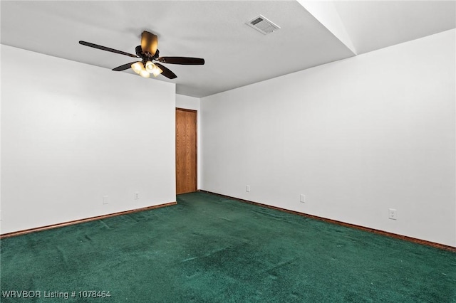 unfurnished room featuring ceiling fan and dark carpet