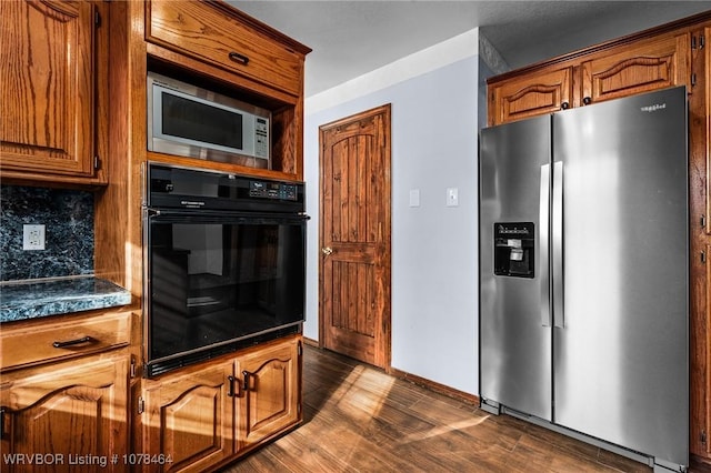 kitchen featuring tasteful backsplash, dark hardwood / wood-style floors, and stainless steel appliances