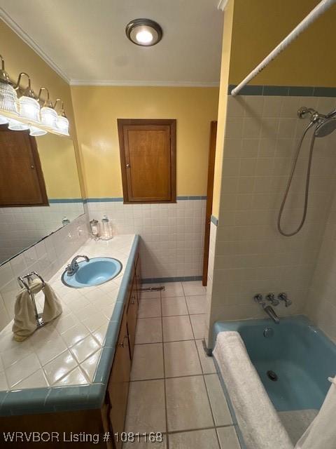 216 Jefferson Dr, Charleston, AR 72933 - full bath featuring tile walls, tile patterned floors, crown molding, vanity, and a wainscoted wall