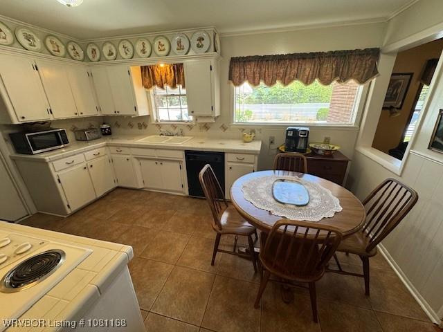 216 Jefferson Dr, Charleston, AR 72933 - kitchen with dishwasher, stainless steel microwave, white cabinetry, tile countertops, and tile patterned flooring