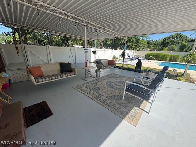 216 Jefferson Dr, Charleston, AR 72933 - fenced backyard featuring a patio area and an outdoor hangout area