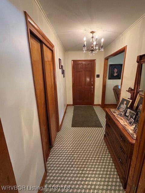 216 Jefferson Dr, Charleston, AR 72933 - hallway featuring a chandelier, crown molding, baseboards, and carpet