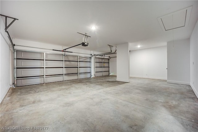 3220 Harmony Rd, Alma, AR 72921 - garage featuring a garage door opener and baseboards
