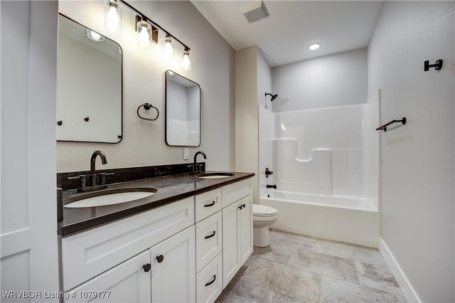 bathroom featuring toilet, tub / shower combination, a sink, and visible vents