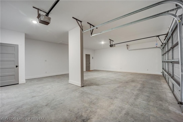 garage with baseboards and a garage door opener