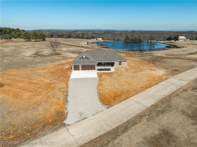 drone / aerial view featuring a rural view and a water view