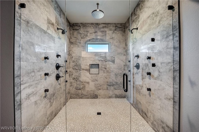 full bath with a shower stall