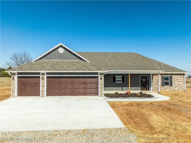 ranch-style home with a garage, covered porch, driveway, and a shingled roof