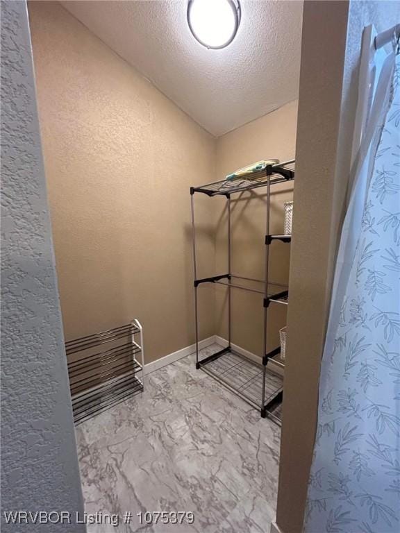 bathroom with a textured ceiling