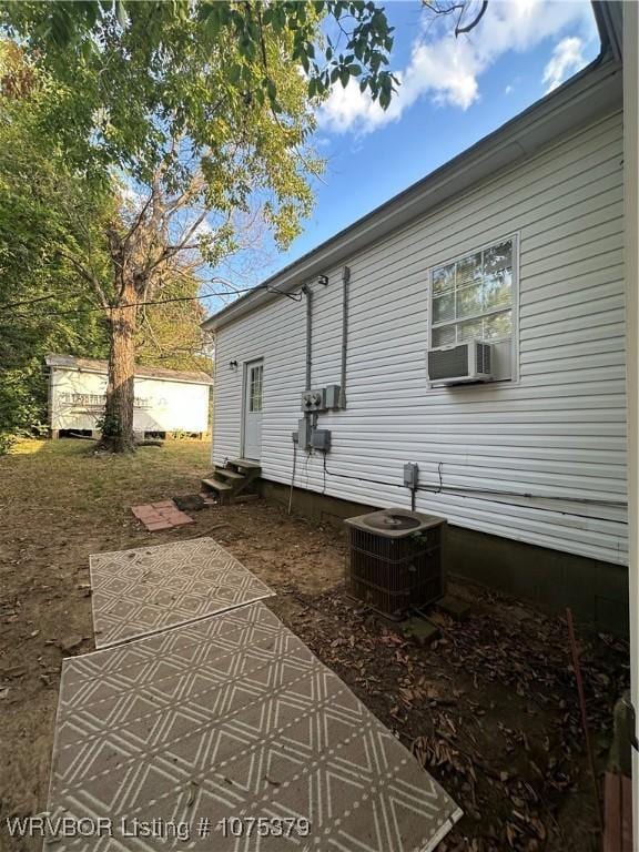 view of property exterior with cooling unit and central AC