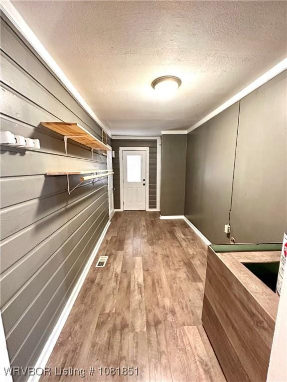 208 Cane Hill St, Van Buren, AR 72956 - corridor with a textured ceiling and wood finished floors