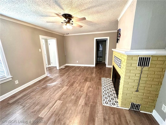 208 Cane Hill St, Van Buren, AR 72956 - unfurnished living room with a ceiling fan, wood finished floors, a textured ceiling, a fireplace, and ornamental molding