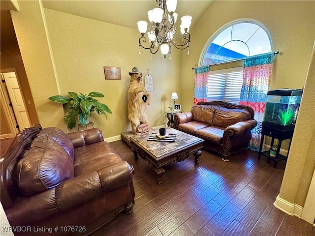 living room with dark hardwood / wood-style floors, vaulted ceiling, and a chandelier