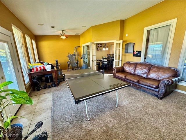 playroom with ceiling fan, light colored carpet, and french doors